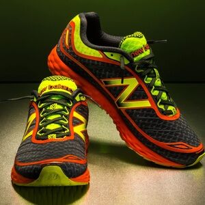 LIKE NEW New Balance Athletic Shoes - Dark Gray and Bright Orange